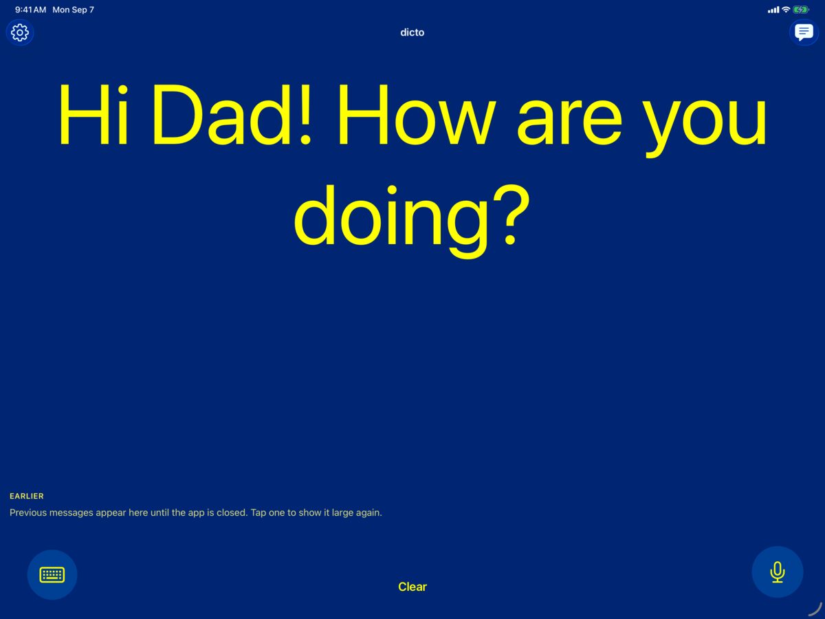 dicto on iPad in the yellow-on-blue high-contrast color scheme showing the spoken message Hi Dad! How are you doing?